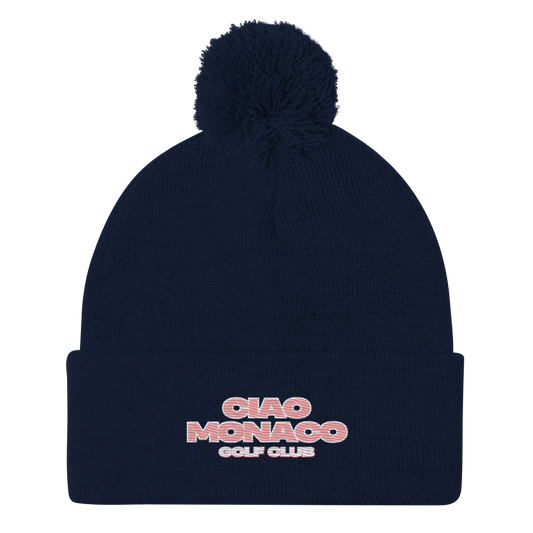 Navy beanie with fold-over cuff, pink embroidered logo on the front, and matching pom-pom on top